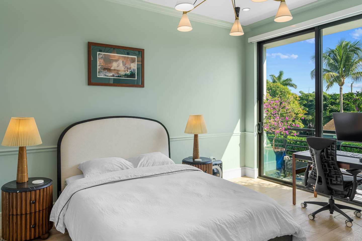 Queen bedroom with dedicated ergonomic workspace